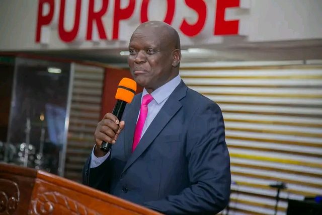 A minister with a microphone at a pulpit