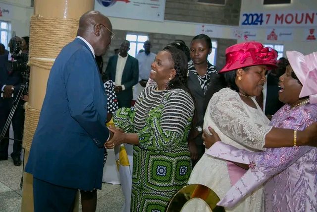 Guests greeting each other warmly in a church hall