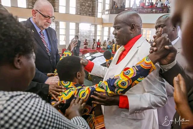 Two ministers at opposite pulpits in a church
