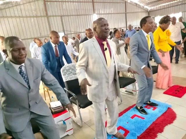Worshippers standing during a service