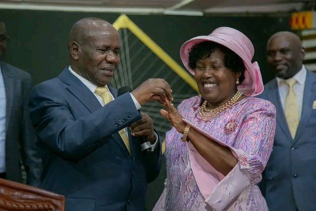 A bishop placing a ring on his wife’s finger