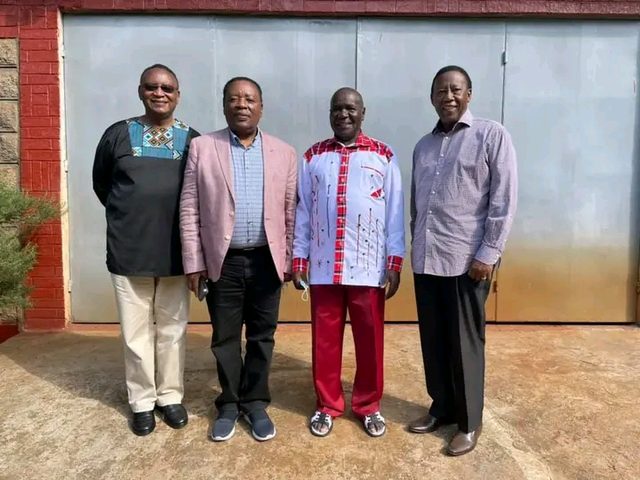 Four ministers standing side by side