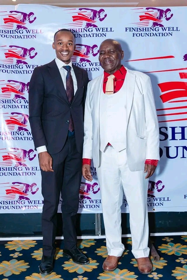 Aaron with his uncle, Bishop Dr William Tuimising